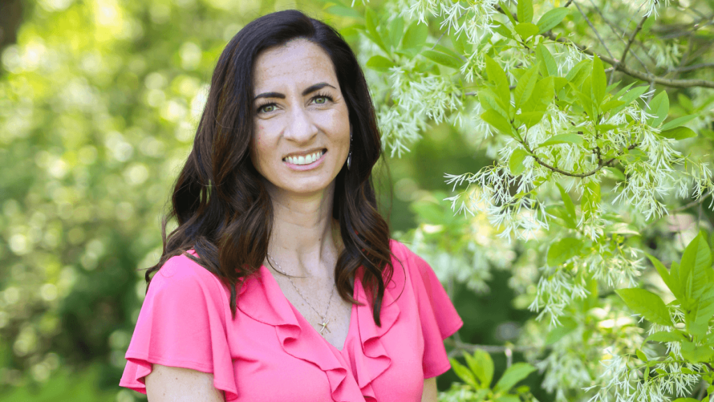 Close-up of Erin Shepherd with trees in the background, provider of SEO services for small businesses.